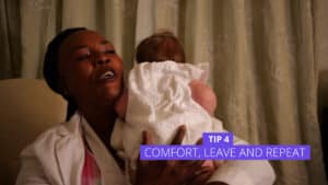 A woman cradles her baby over her shoulder in a warm, domestic setting. The baby, dressed in white, is learning to sleep train. Text on the image reads Tip 4: Comfort, Leave and Repeat. Night Nannies London